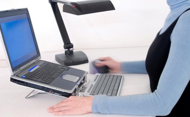 Lady on Ergo Keyboard Laptop