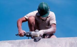 construction worker grinding concrete