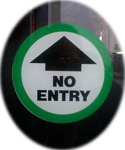 upward arrow with text "no entry, inside a green circle